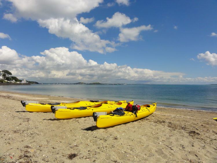 Top 5 things to do in the New Zealand summer podcast 1 Kayak on beach NZ