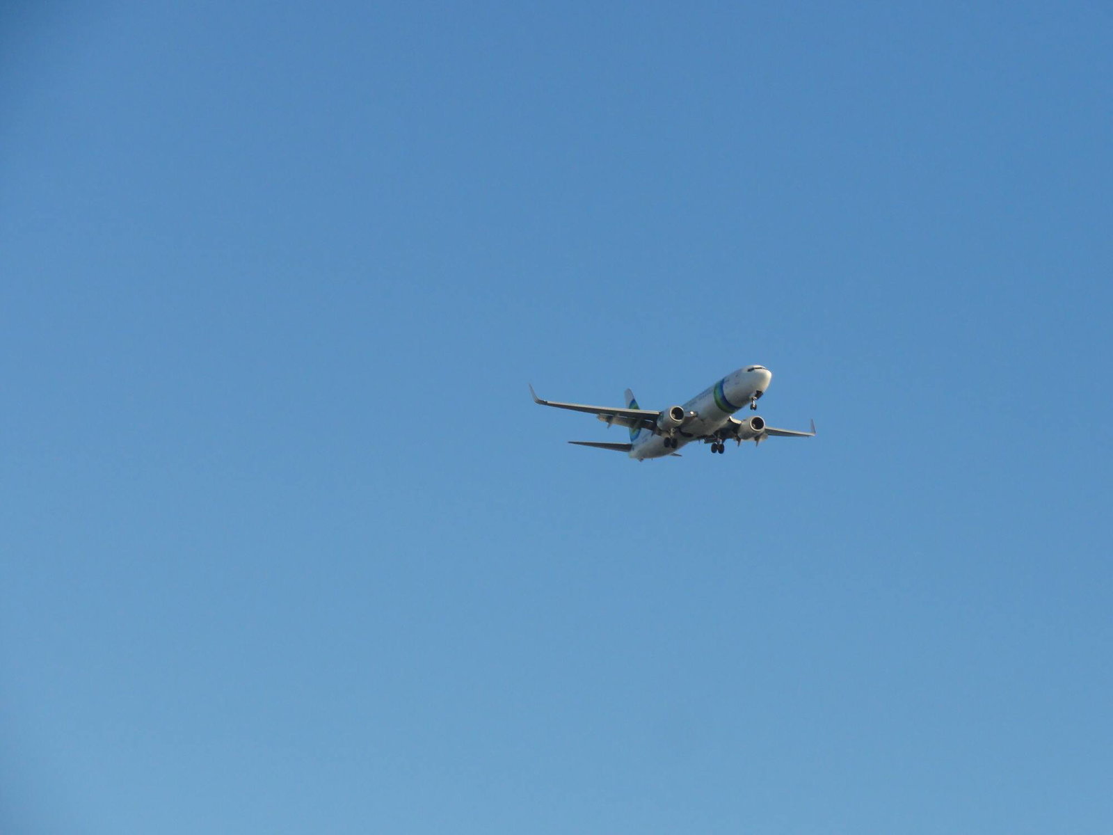 How to get around the USA 1 Plane flying in blue sky.