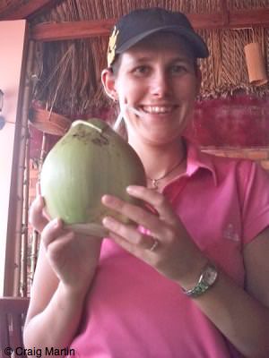 mui ne linda eating a coconut - Travel diary 2010