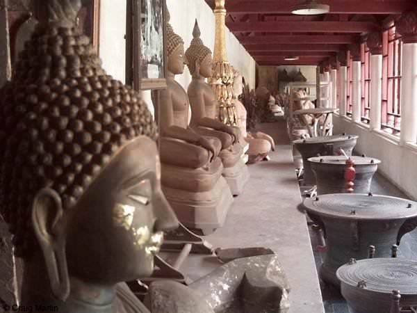stray backpacker bus thailand laos buddha statue with little gilding left