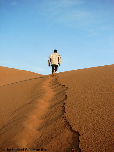 walking alone dreaming desert dunes sand walking alone dreaming desert dunes sand - Planning travel as a couple podcast
